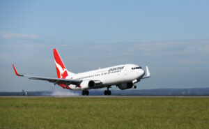 Qantas 737-800 on touchdown. (The carrier is offering a new discount of carers of disabled passengers.)
