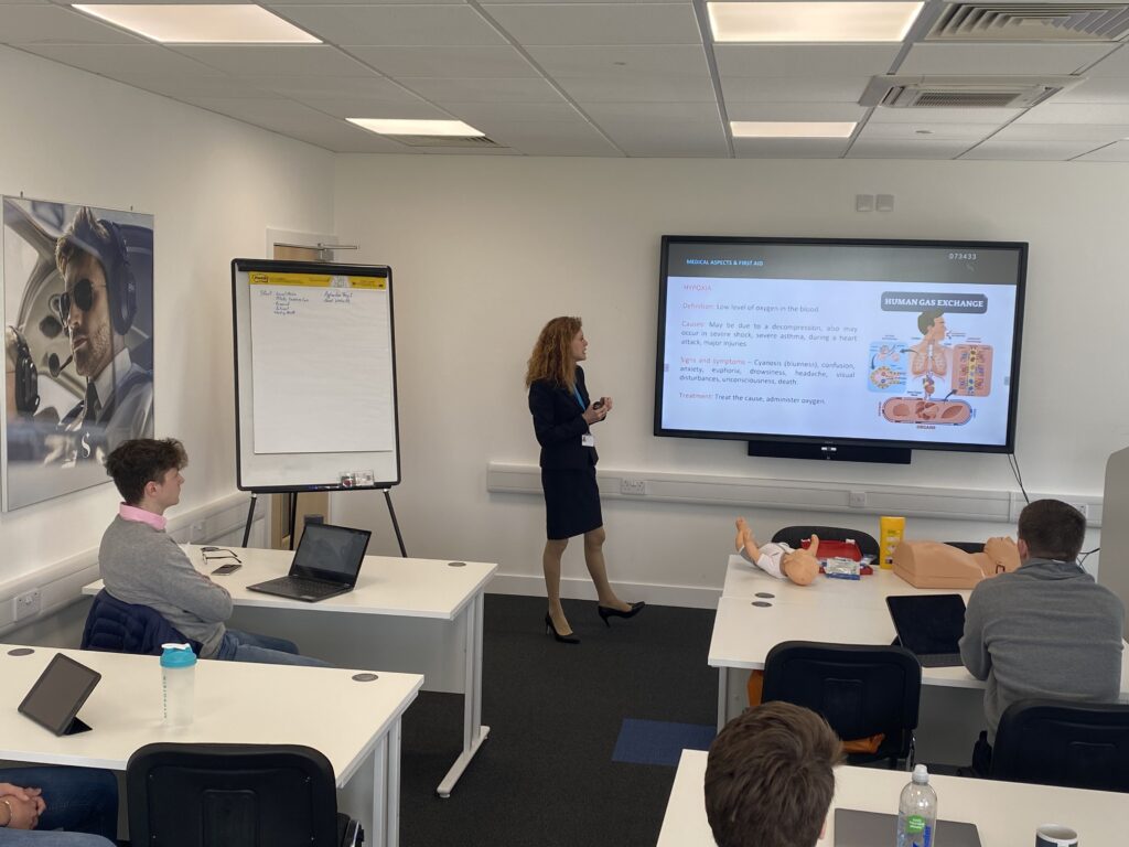 Skyborne’s cabin crew attestation course includes a mix of practical and classroom teaching. Here, Hajati Treacher-Morley leads a class..