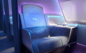 PureSkies by PriestmanGoode. Purple and blue lighting casting down on a business class seat. Hygienically safe air travel.