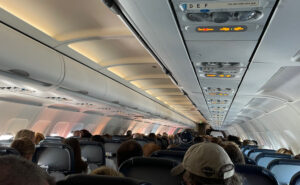 An A320 cabin full of air travelers. This image shows the tops of the traveler heads and the PSUs running down the length of the aircraft. AirFi targets this market.