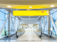 Terminal 8 signage above the entrance to a large hall at JFK