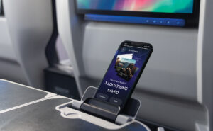 Panasonic Passpoint is being displayed on a mobile device that is set up on a PED holder.